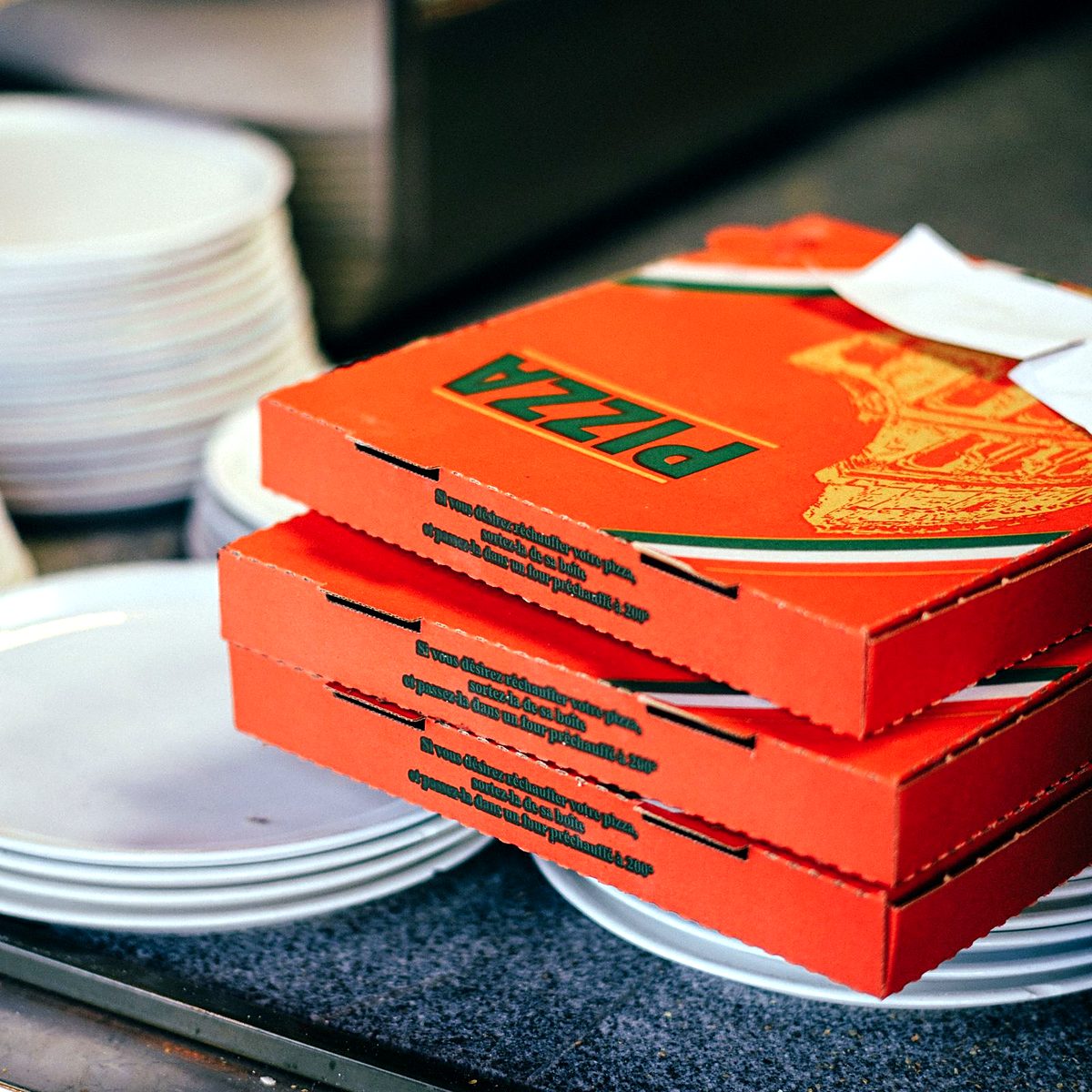 Stack of printed pizza boxes
